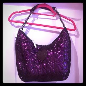 Purple Betsey Johnson handbag.